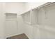 Walk-in closet with metal storage shelving and carpet at 35459 N Seedling St, San Tan Valley, AZ 85144