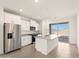 Beautiful kitchen featuring stainless steel appliances, granite countertops, and a center island at 35459 N Seedling St, San Tan Valley, AZ 85144