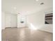 Bright living room showcasing natural light, neutral paint, and tile flooring at 35459 N Seedling St, San Tan Valley, AZ 85144