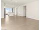 Inviting living room featuring neutral tile flooring and bright, natural light at 35459 N Seedling St, San Tan Valley, AZ 85144