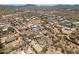 Expansive aerial view of a desert community featuring custom homes with large lots and beautiful mountain views in the distance at 39606 N 3Rd Ave, Phoenix, AZ 85086