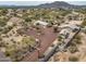 Desert home aerial featuring a circular driveway, privacy wall, native vegetation, and spacious grounds at 39606 N 3Rd Ave, Phoenix, AZ 85086