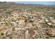 This aerial showcases homes in a desert neighborhood with expansive lots, horse property, and breathtaking mountain views at 39606 N 3Rd Ave, Phoenix, AZ 85086