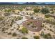 Expansive aerial view of desert home and landscape with mountain views, native trees, and circular driveway at 39606 N 3Rd Ave, Phoenix, AZ 85086