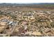 Wide aerial view of a desert community with homes, landscape, and mountain views in the distance at 39606 N 3Rd Ave, Phoenix, AZ 85086