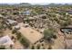 Aerial view of horse property with riding arena, covered stalls, and nearby homes in the area at 39606 N 3Rd Ave, Phoenix, AZ 85086