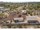 Aerial view showing desert home with privacy wall, guest house, circular drive, and native landscaping at 39606 N 3Rd Ave, Phoenix, AZ 85086