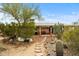 Backyard featuring desert landscaping, stone pathway and covered patio at 39606 N 3Rd Ave, Phoenix, AZ 85086