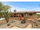 Backyard featuring desert landscaping, stone pathway and covered patio with brick at 39606 N 3Rd Ave, Phoenix, AZ 85086