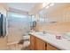 Standard bathroom featuring a vanity, toilet, and a shower with glass door at 39606 N 3Rd Ave, Phoenix, AZ 85086