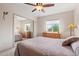 Bedroom with neutral tones, ceiling fan, carpet, and desert view window at 39606 N 3Rd Ave, Phoenix, AZ 85086