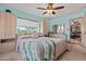 Bright bedroom with desert views, light blue walls, and light beige furniture at 39606 N 3Rd Ave, Phoenix, AZ 85086