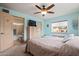Bedroom with light blue walls, carpet flooring, and ensuite bathroom at 39606 N 3Rd Ave, Phoenix, AZ 85086