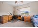 Functional bedroom with desk, chair, and twin bed near well-lit windows at 39606 N 3Rd Ave, Phoenix, AZ 85086
