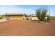 This property features a detached garage with a large gravel driveway and desert landscaping at 39606 N 3Rd Ave, Phoenix, AZ 85086
