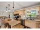 Modern kitchen featuring granite countertops, stainless steel appliances, and a breakfast bar with backyard views at 39606 N 3Rd Ave, Phoenix, AZ 85086