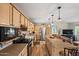 Beautiful kitchen with stainless steel appliances, granite countertops, and seamless connection to the living area at 39606 N 3Rd Ave, Phoenix, AZ 85086