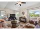 Comfortable living room with neutral tones, ceiling fan, and natural light at 39606 N 3Rd Ave, Phoenix, AZ 85086