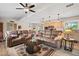 Inviting living room featuring hardwood floors, a ceiling fan, and views into the kitchen at 39606 N 3Rd Ave, Phoenix, AZ 85086