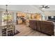 Open-concept living space boasts a spacious kitchen, dining area, and living room, all with natural wood accents at 39606 N 3Rd Ave, Phoenix, AZ 85086