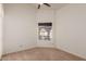 Clean bedroom featuring neutral carpet, a window, and a ceiling fan at 412 W Curry St, Chandler, AZ 85225