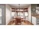 Bright breakfast nook with a round table, views of the backyard and pool through large windows at 412 W Curry St, Chandler, AZ 85225