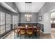 Elegant dining room featuring a large table with seating for six and stylish pendant lighting at 412 W Curry St, Chandler, AZ 85225