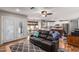 Relaxing living room with dark leather sofa open to the kitchen and breakfast nook at 412 W Curry St, Chandler, AZ 85225