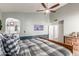 Comfortable main bedroom featuring a ceiling fan, ensuite bath, and calming paint scheme at 412 W Curry St, Chandler, AZ 85225