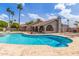 Backyard pool area featuring a diving board and lounge chairs, surrounded by desert landscaping at 412 W Curry St, Chandler, AZ 85225