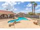 Backyard pool featuring a custom shape, desert landscaping, and a covered patio area with arched openings at 412 W Curry St, Chandler, AZ 85225