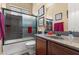 Well-appointed bathroom features a shower-tub combo, granite countertops, and modern fixtures at 4340 S Marble St, Gilbert, AZ 85297