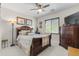 A warm bedroom featuring a sleigh bed, soft lighting, and decorative accents for a cozy feel at 4340 S Marble St, Gilbert, AZ 85297