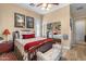 Cozy bedroom offers comfortable bedding, mirrored closets, and decorative accents for a relaxing retreat at 4340 S Marble St, Gilbert, AZ 85297