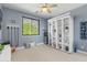 Nautical-themed bedroom with shelving, decor, and blue accents creating a relaxing space at 4340 S Marble St, Gilbert, AZ 85297