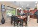 Cozy dining area with wooden table and chairs, complemented by natural light at 4340 S Marble St, Gilbert, AZ 85297