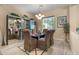 Elegant dining room featuring a modern chandelier, mirrored display cabinet, and stylish decor, ideal for formal gatherings at 4340 S Marble St, Gilbert, AZ 85297