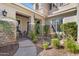 Attractive home exterior with a decorative fountain and lush landscaping, offering curb appeal at 4340 S Marble St, Gilbert, AZ 85297