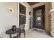Inviting front porch with seating, decorative accents, and a welcoming entrance at 4340 S Marble St, Gilbert, AZ 85297