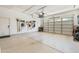 A well-organized garage featuring ample storage, tool organizers, and an epoxy-coated floor at 4340 S Marble St, Gilbert, AZ 85297