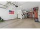 A well-organized garage with epoxy floor, storage racks and cabinets, and overhead lighting at 4340 S Marble St, Gilbert, AZ 85297