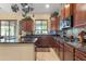This spacious kitchen features wooden cabinets, granite counters, and stainless steel appliances at 4340 S Marble St, Gilbert, AZ 85297