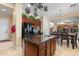 This spacious kitchen features wooden cabinets, granite counters, and a central island at 4340 S Marble St, Gilbert, AZ 85297