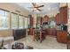Charming eat-in kitchen featuring wood cabinets, center island, granite countertops, and modern appliances at 4340 S Marble St, Gilbert, AZ 85297