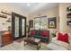 Inviting living room boasts comfortable seating, a wooden table, and elegant decor elements at 4340 S Marble St, Gilbert, AZ 85297