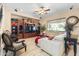 Comfortable living room features a custom entertainment center, tile floors, and neutral decor at 4340 S Marble St, Gilbert, AZ 85297