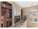 Upper loft includes bookshelves with a view of the neighborhood and custom woodwork at 4340 S Marble St, Gilbert, AZ 85297