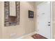Mud room entry with garage access, decorative wall art and tile flooring at 4340 S Marble St, Gilbert, AZ 85297