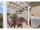 Charming patio area with a shaded pergola and comfortable seating arrangement at 4340 S Marble St, Gilbert, AZ 85297