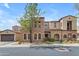 Charming two-story home featuring a stone facade, arched entryway, and well-manicured landscaping at 4777 S Fulton Ranch Blvd # 1029, Chandler, AZ 85248